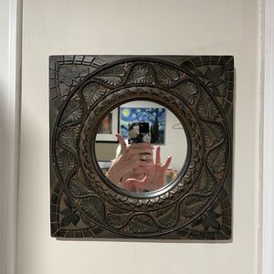 A square carved frame with a mirror insert 12 in. mirror